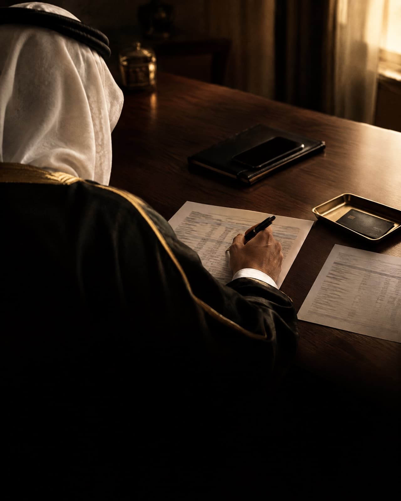 A lawyer marking transfers on bank statements with a client across a bright meeting table.
